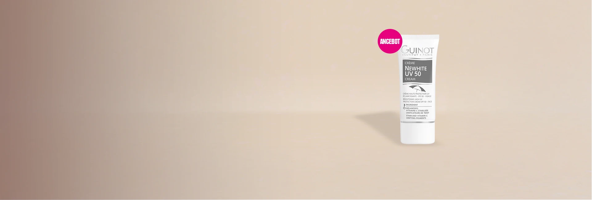 Das Monatsangebot Guinot Newhite UV 50 steht vor einer hellen Wand.