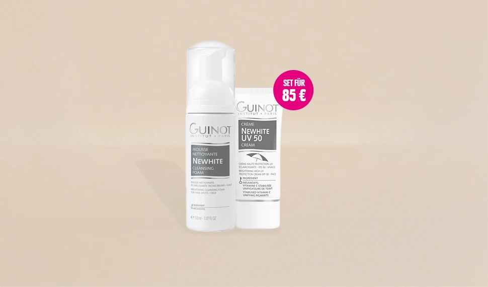 Guinot NeWhite Cleansing Foam und NeWhite UV50 stehen vor einem beigen Hintergrund. Das Set ist reduziert auf 85 €.