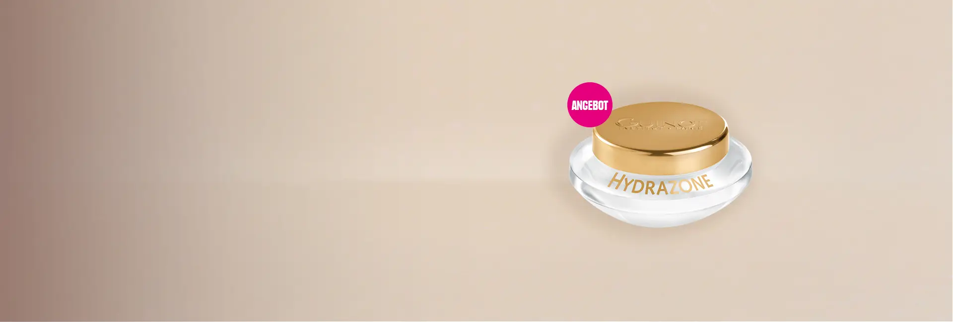 Tiegel Guinot Hydrazone vor beige­farbenem Hintergrund, mit pinkem Kreis und weißer Aufschrift ‚Angebot‘ oben links.